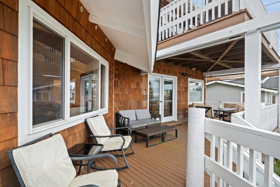 Unwind on your private deck with comfy seating and coastal charm, perfect for morning coffee or evening relaxation.