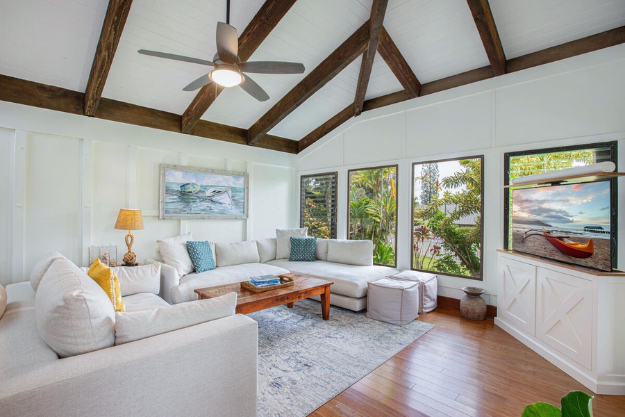Comfort meets island elegance in this breezy living space with new furnishings and natural light.
