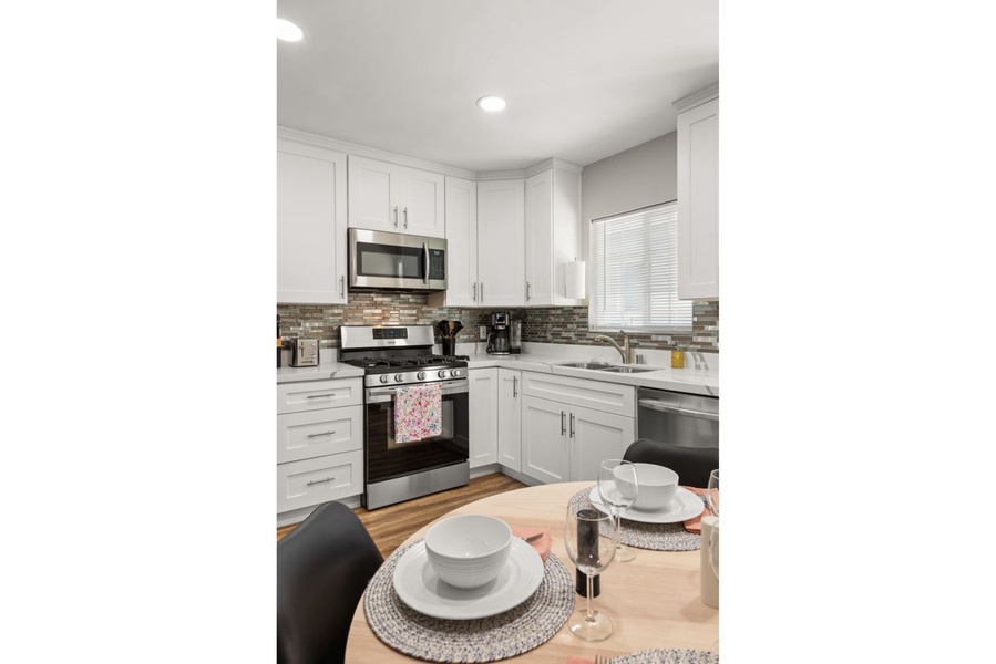 The kitchen features modern cabinetry and plenty of storage space.