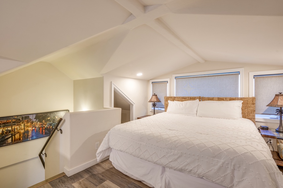 Bask in the comfort of this bright and spacious bedroom with vaulted ceilings.
