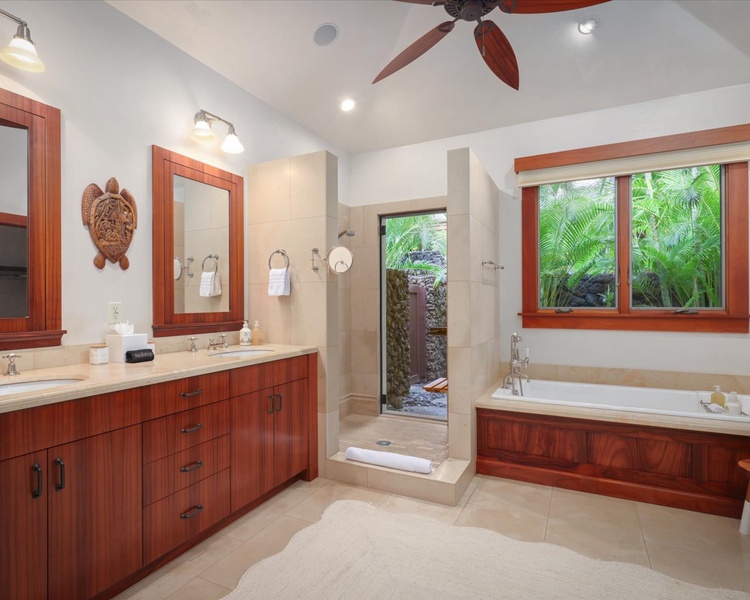 Enjoy the amenities of the primary bathroom- dual sinks, walk-in shower, oversized soaking tub, tropical atrium & walk-in closet