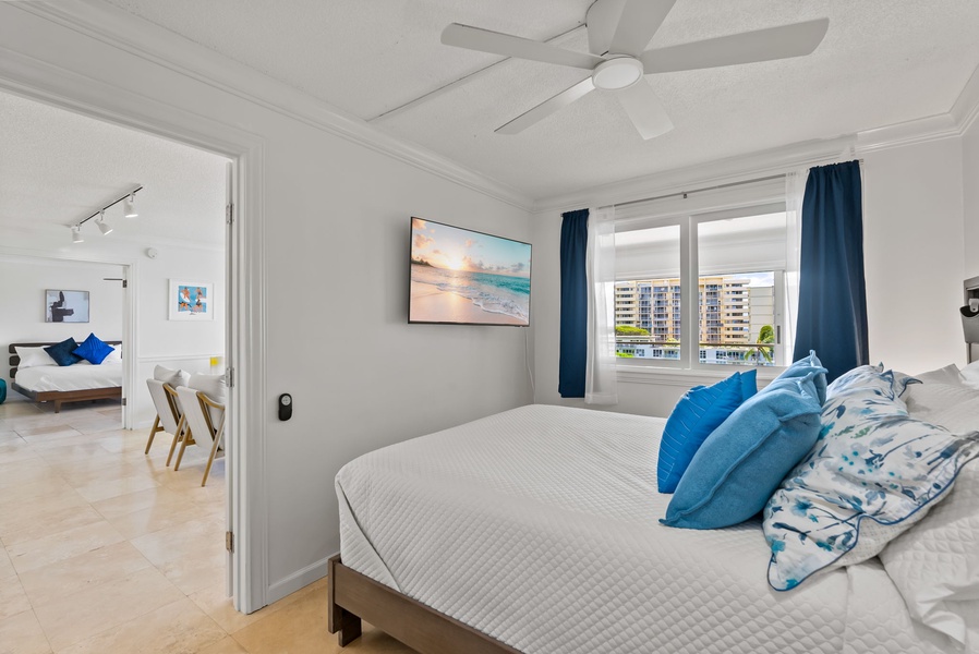 The primary bedroom has a queen bed, TV and ensuite bath.