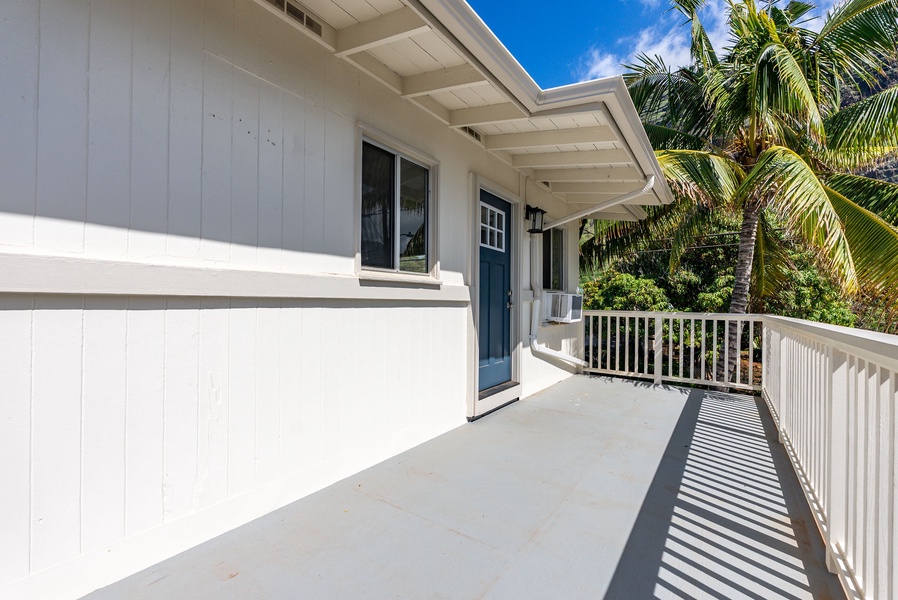 Spacious outdoor walkway with access to lanai and living areas.