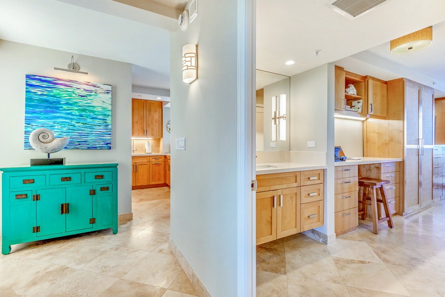 Spacious hallway leading to a modern bathroom.