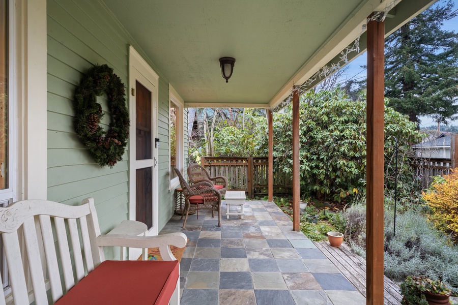 Welcoming porch decorated with wreaths and holiday touches, radiating seasonal warmth.