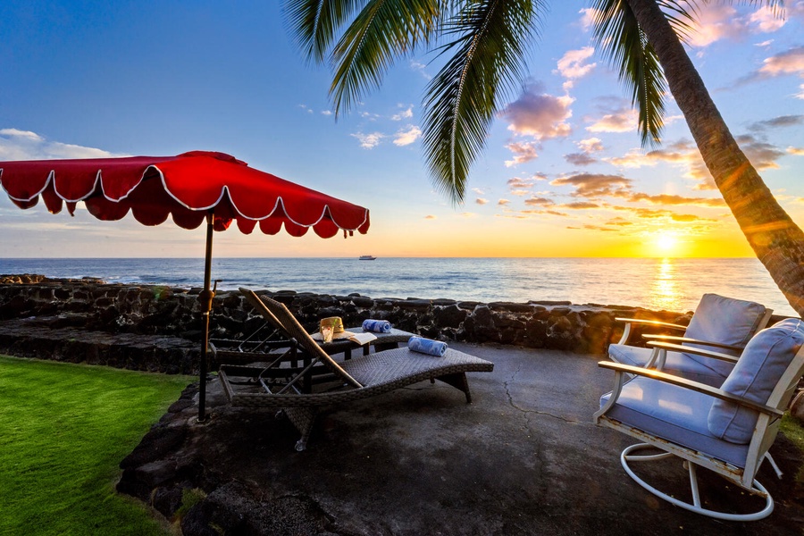 Sunset loungers by the ocean—your private front-row seat to Kona’s golden skies.