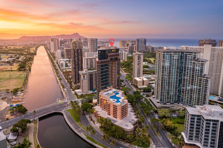 Evening settles over Waikiki, Diamond Head on the horizon and the whole skyline turning gold.