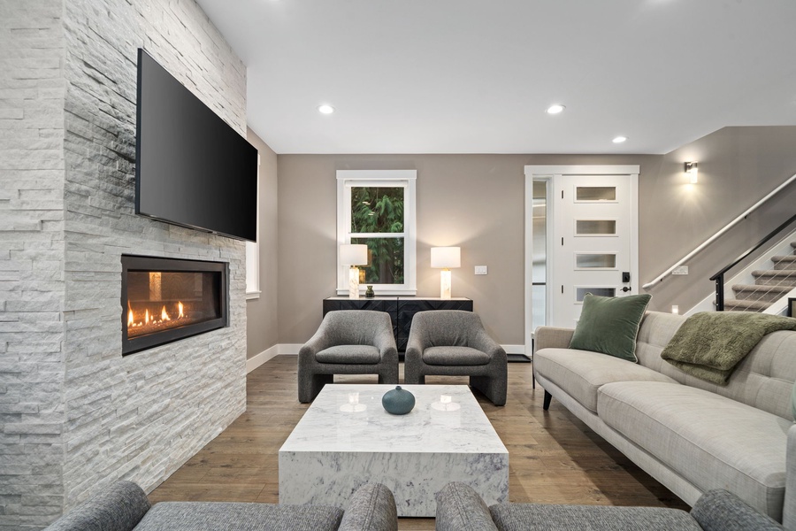 Living space with plush seating by your cozy fireplace, where modern elegance meets warmth.