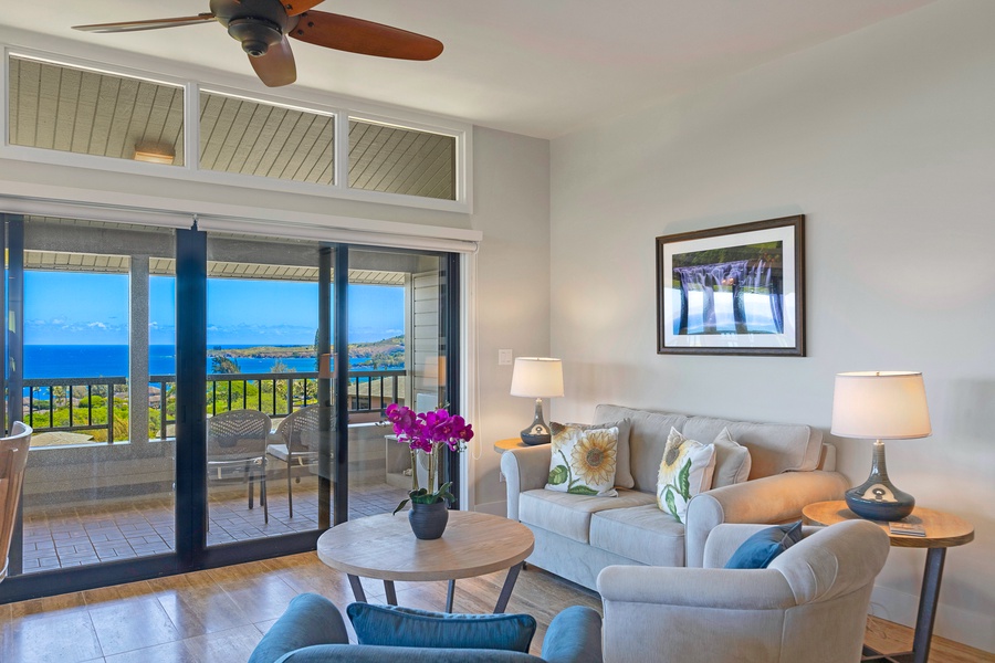 Relax in the comfortable living room with natural light pouring in through the sliding glass doors