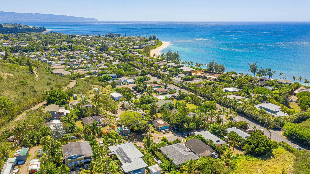 Aerial view reveals how close you are to the shoreline—just steps from the legendary North Shore coast.