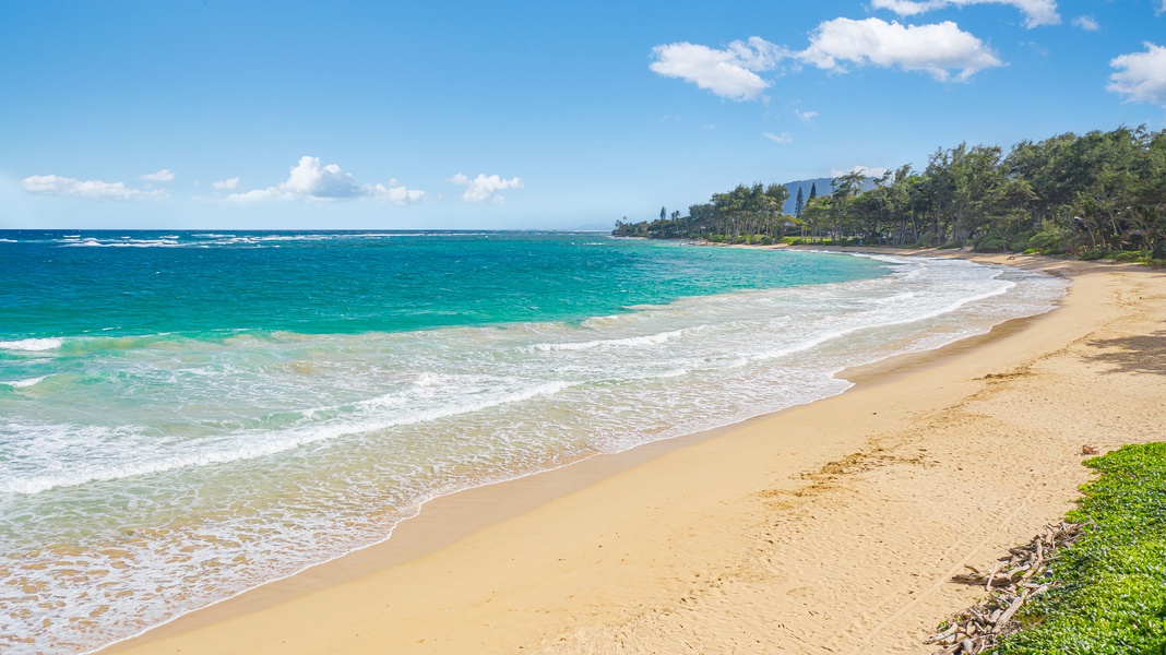 A peaceful sandy beach just steps away, perfect for sunbathing or a morning stroll.