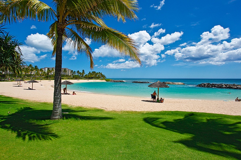 Relax on the green grass and at the sandy beaches of the lagoon.