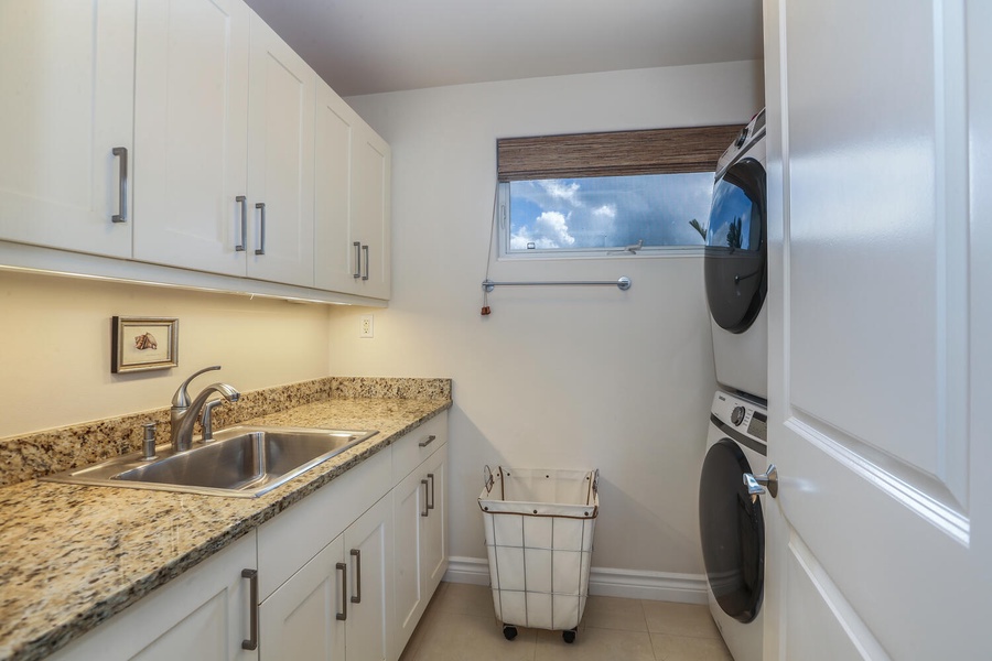 Laundry room with full size washer, dryer and sink