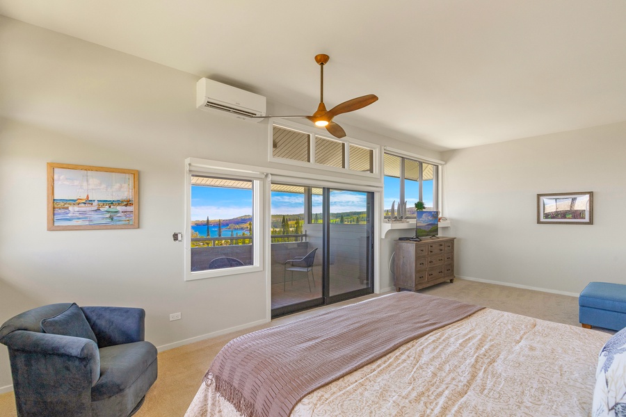 The spacious bedroom opens directly onto a private lanai, perfect for enjoying a morning coffee