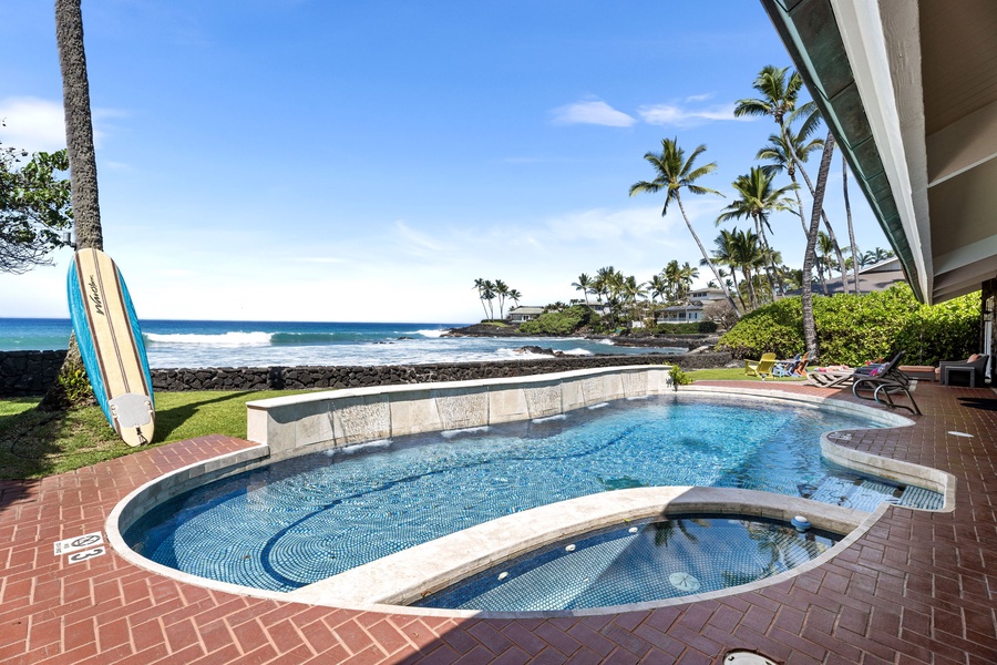 Unwind by your private pool, with the ocean stretching wide beyond.