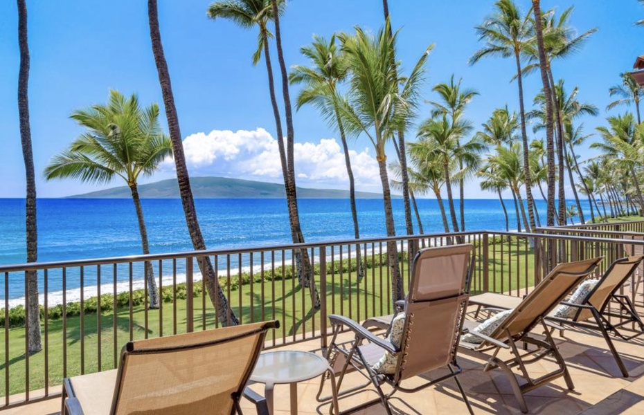 Relax on the patio with serene oceanfront scenery, perfect for unwinding.