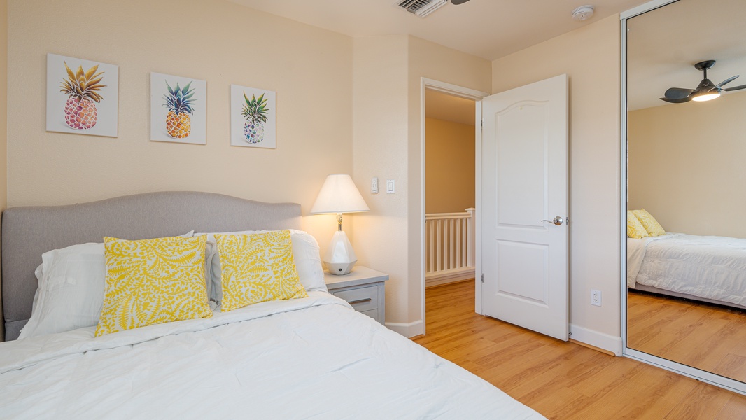 The third guest bedroom with bright accents and soft lighting.