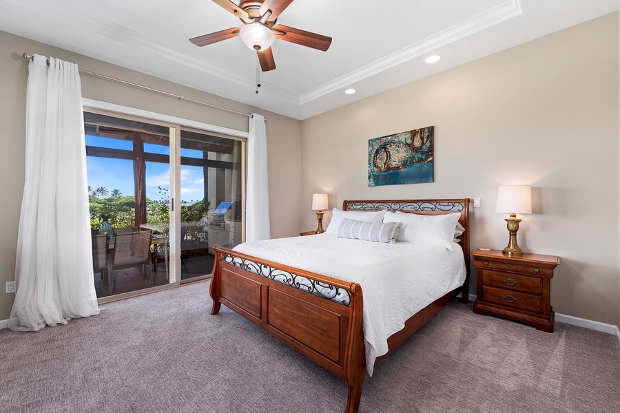 Primary suite with lanai accessible through glass sliders.
