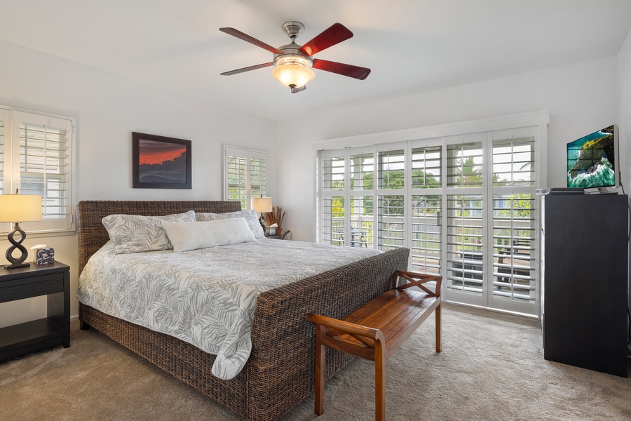 The primary guest bedroom with lovely views and ceiling fan.