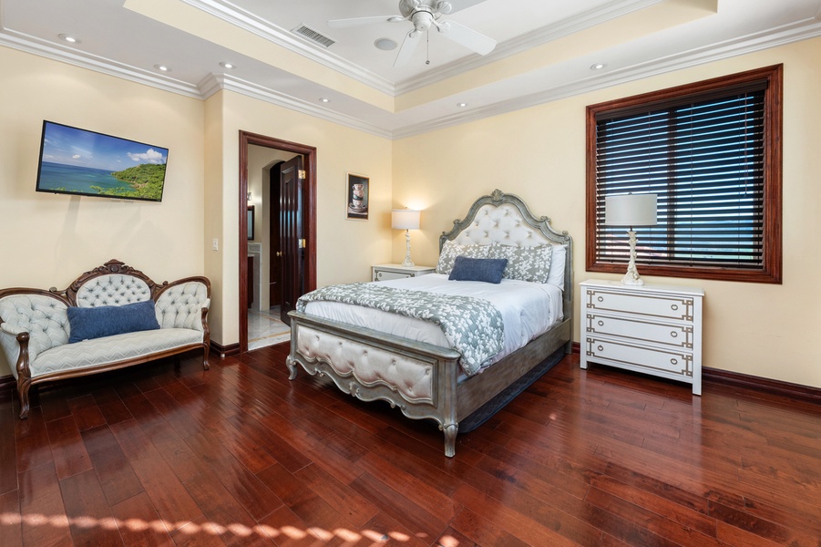 A generous window brings an airy feel to this inviting bedroom retreat.