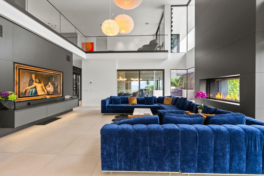 Open-concept living framed by clean lines, natural light, and poolside views.