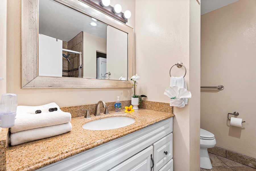 Clean and modern ensuite bathroom featuring a stylish single sink — a private oasis for freshening up.