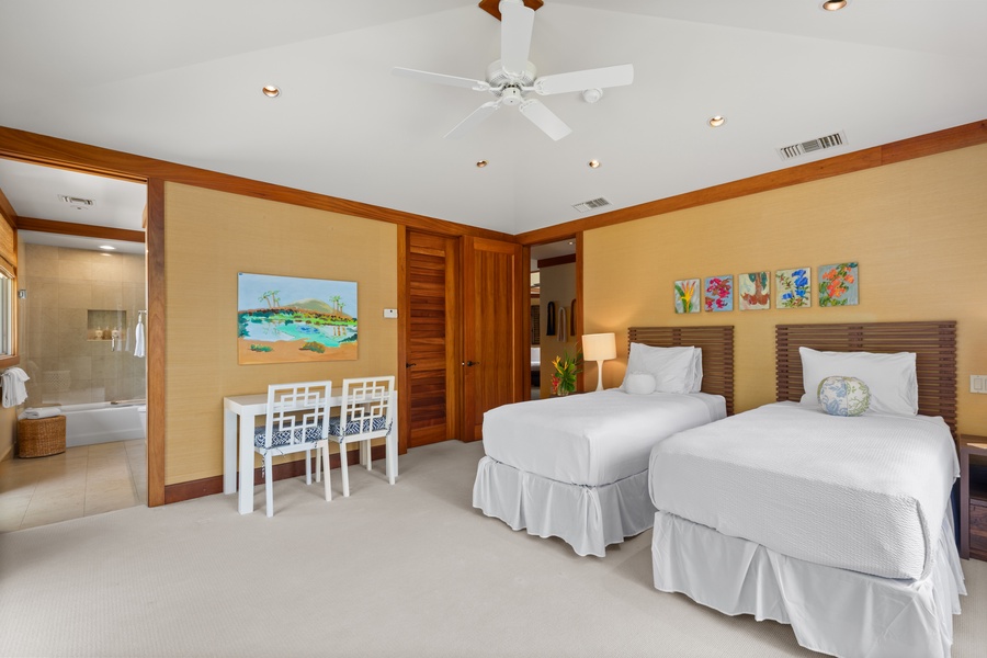 Twin beds with playful touches and desk space—perfect for kids, teens, or flexible sleeping arrangements.
