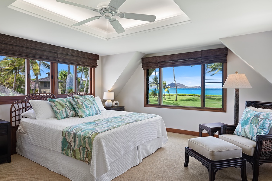 Upstairs primary bedroom with a king-size bed and stunning ocean views.