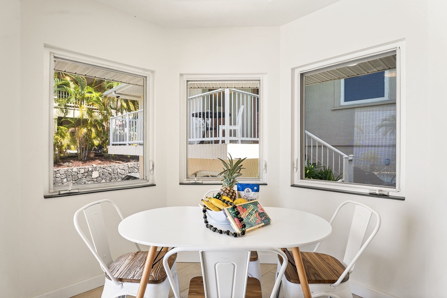Cozy round table where you can enjoy meals while taking in tropical garden views through three large windows.