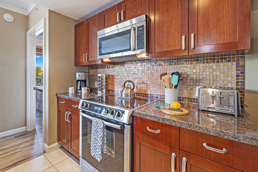 Chef-ready kitchen in Honua Kai Konea 230/232 with Bosch appliances, granite counters, and custom cabinetry
