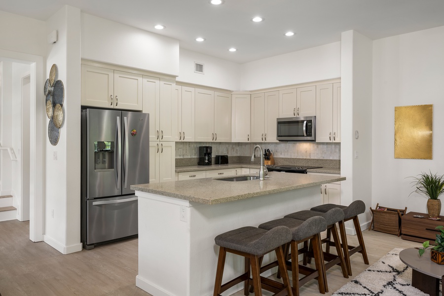 A chef’s dream kitchen with modern stainless steel appliances, granite countertops, and plenty of prep space.