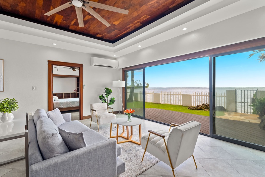 Elegant living area with vaulted ceilings and ocean views for ultimate relaxation.