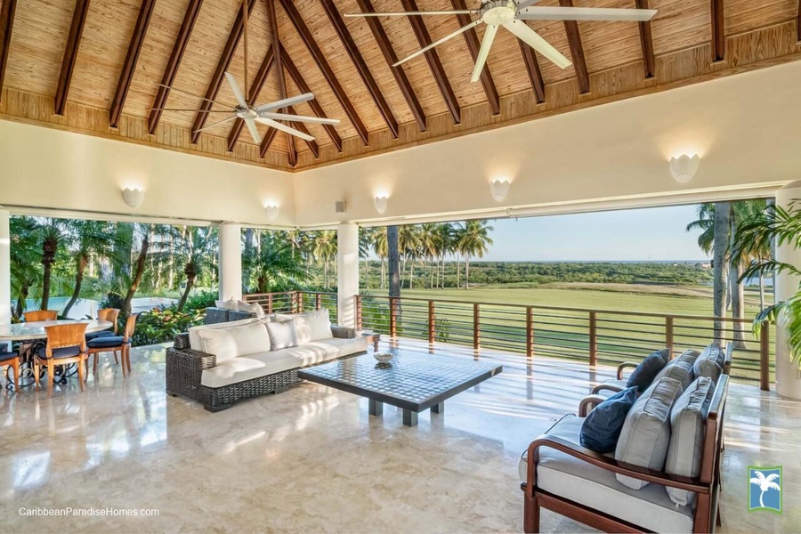 Relax in the expansive open-air living space, offering breathtaking views of the surrounding landscape.