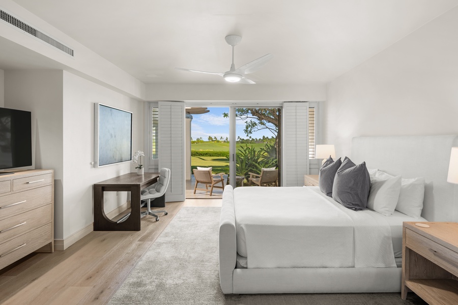 Wake up to tropical paradise in your serene bedroom, where clean lines and soft linens create the perfect retreat.