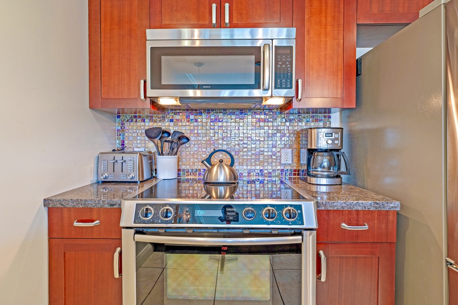 The kitchen features stainless steel appliances.