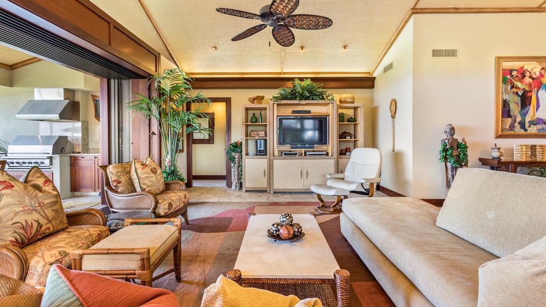 Side View of Living Area with Ample Seating & Flatscreen TV - Pocket Doors to Lanai for Indoor/Outdoor Living.