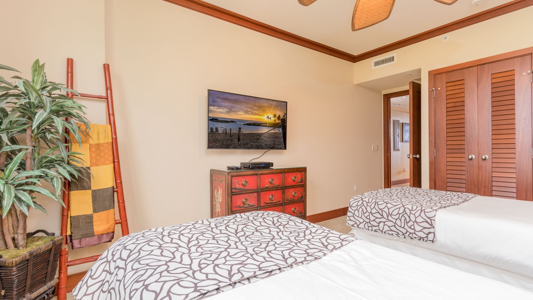 The third guest bedroom features extra long twin beds.