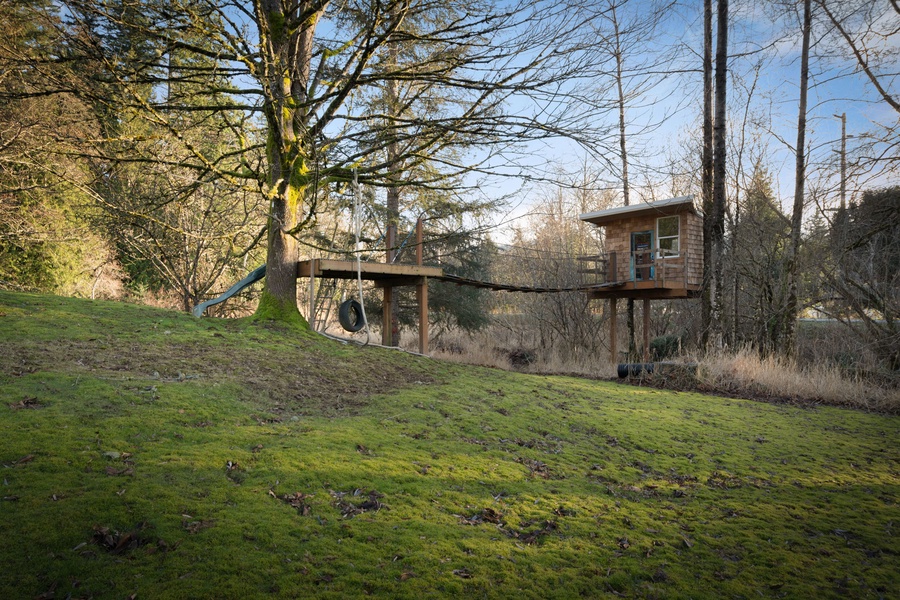 Unique treehouse retreat elevated among mature trees, offering an extraordinary escape surrounded by peaceful natural woodland setting.