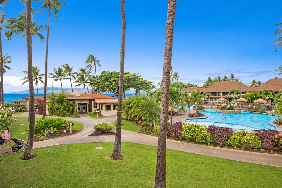 This view showcases the lush tropical landscaping and sparkling pool area, inviting you to relax and unwind in the heart of the resort