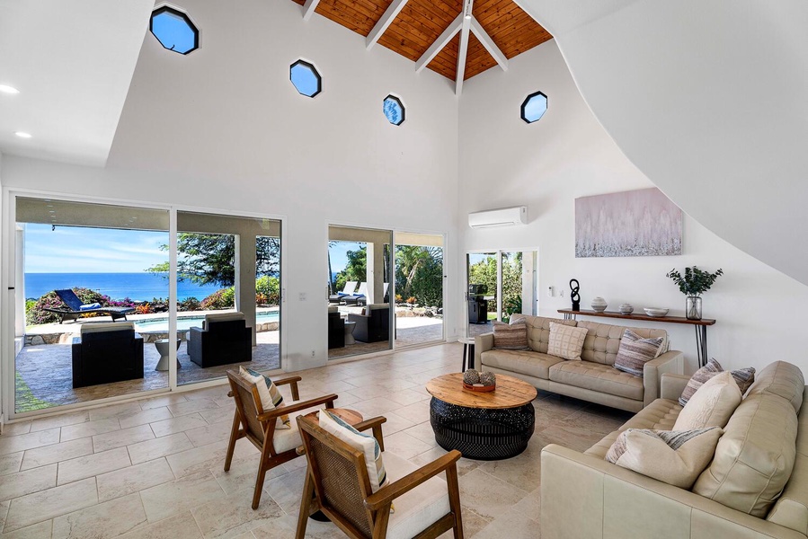 Experience the grandeur of vaulted ceilings and sunlit interiors in the spacious living area.