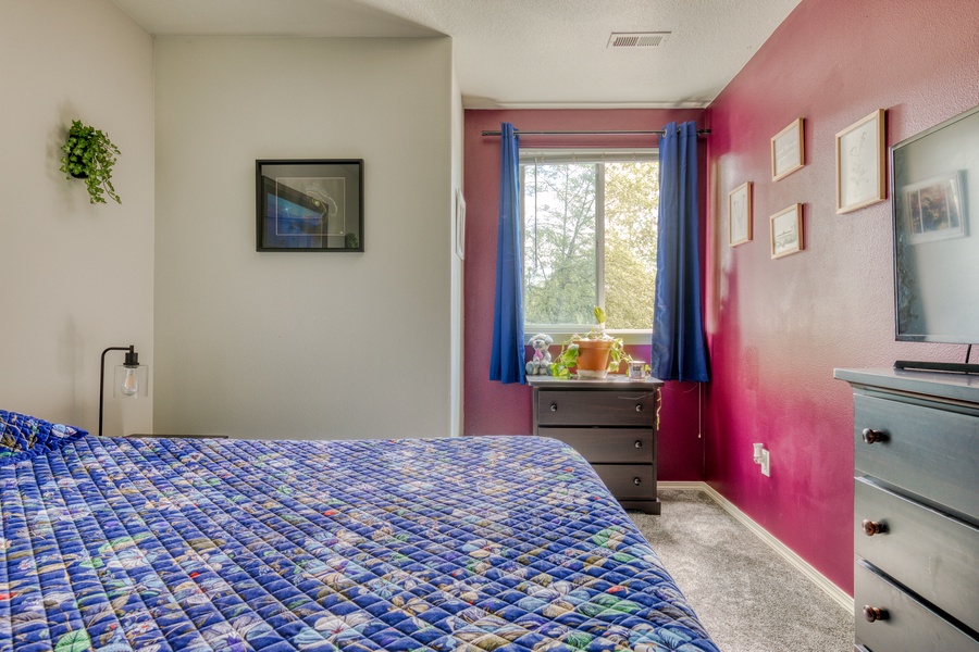 The colorful queen bedroom