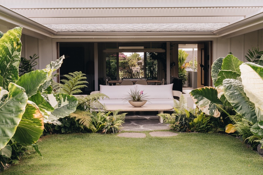 Indoor-outdoor living comes naturally in this beautifully landscaped courtyard setting.