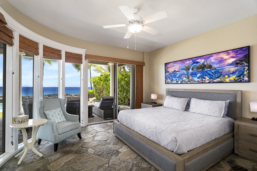 Downstairs bedroom with king bed, air conditioning, and private lanai access.