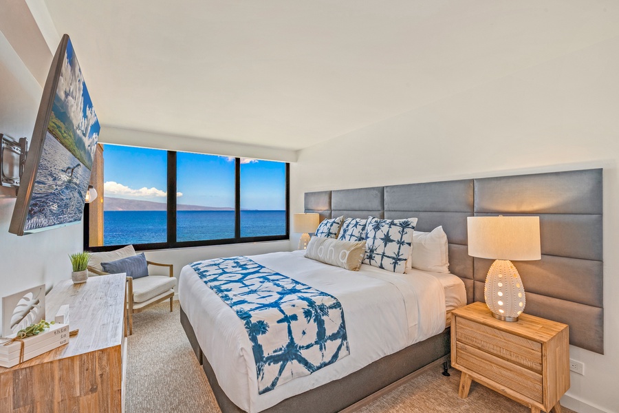 Wake up to stunning ocean views from the comfort of this spacious and stylish bedroom.