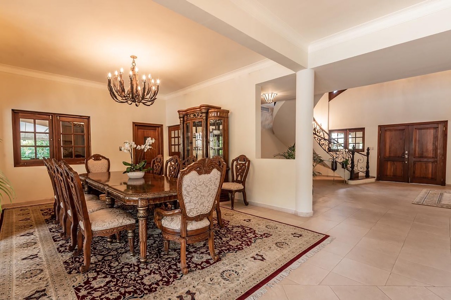 Dine in style in the elegant dining space featuring a long table for ten.