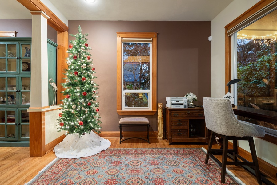 Work or write holiday cards in this peaceful, tree-lit study with natural light.