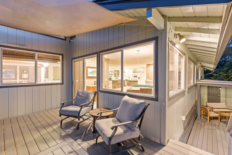 This covered lanai nook is made for morning coffee or quiet evenings with a good book.