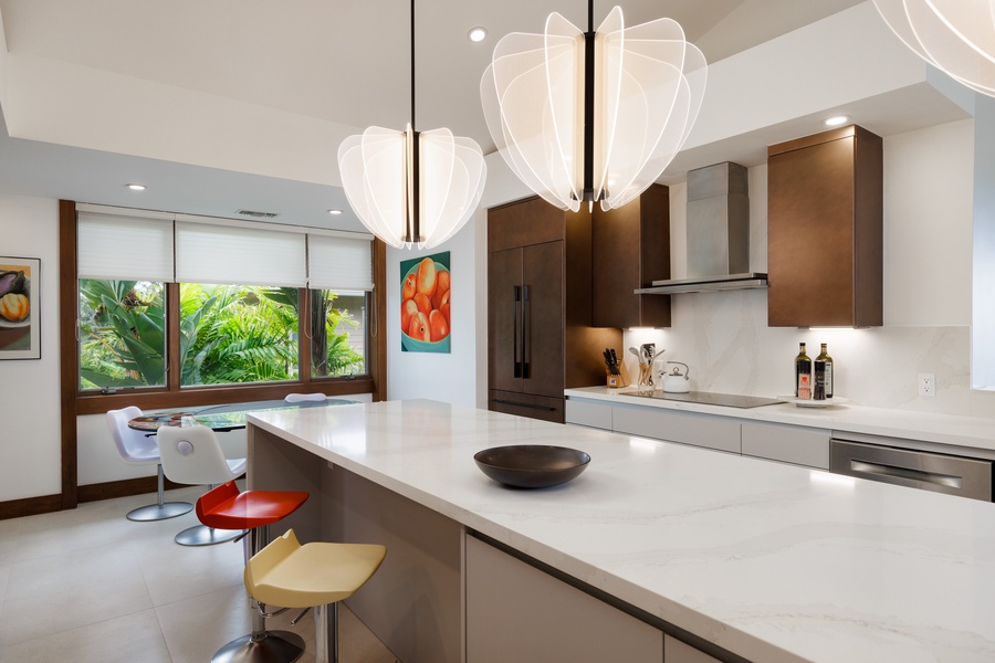 The island bar offers the ideal spot for casual meals or lively conversations while cooking.