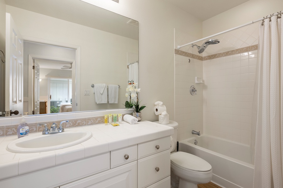 Second bathroom with elegant quartz vanity and tub/shower combo for added comfort and flexibility.