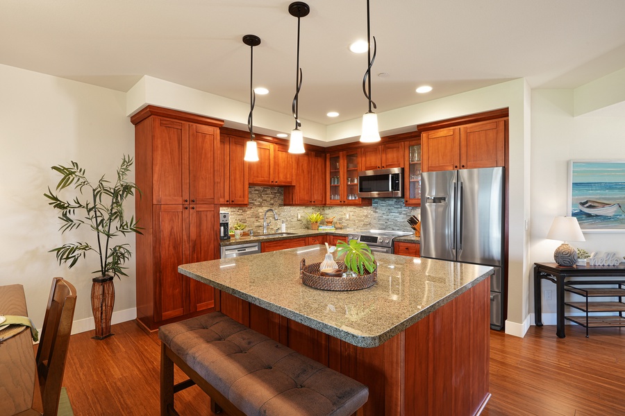Warm kitchen with rich wooden cabinetry and a spacious island for family gatherings.